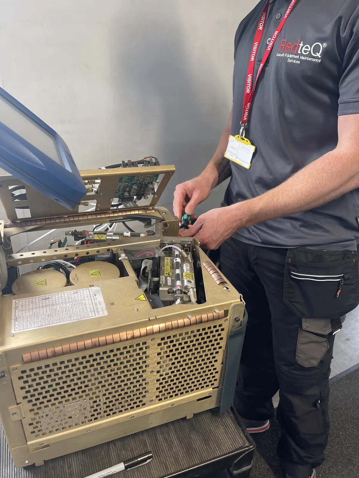 RedteQ engineer repairing an IONSCAN 500DT trace detector