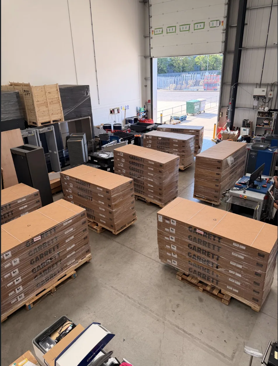 Pallets of Garrett Paragon walk-through metal detectors arriving at the RedteQ facility in Hampshire
