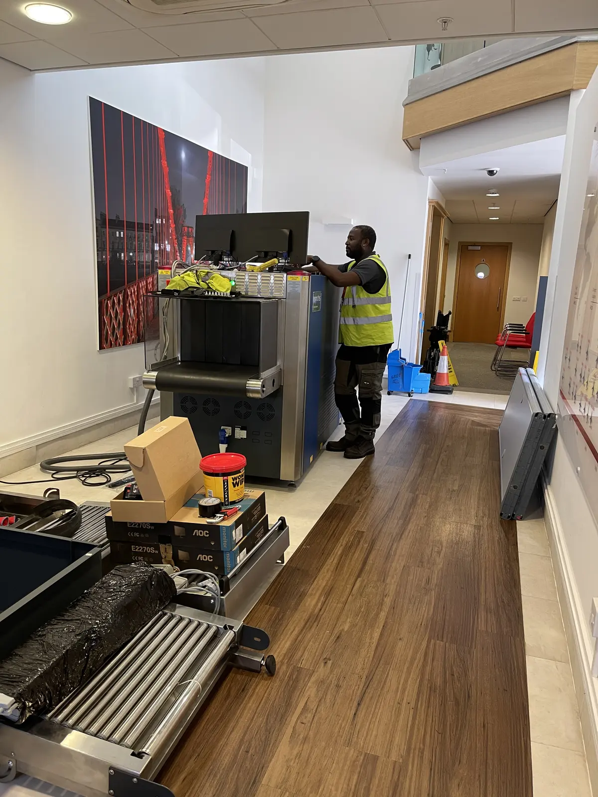 RedteQ engineers manoeuvring an X-ray machine into position during installation