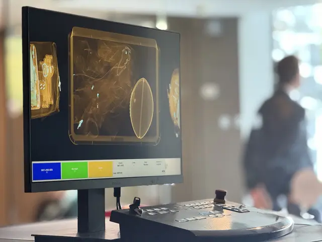 Bag scan on screen at an NFL event checkpoint